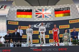 The podium (L to R): Nico Rosberg (GER) Mercedes AMG F1, second; Lewis Hamilton (GBR) Mercedes AMG F1, race winner; Sebastian Vettel (GER) Ferrari, third. 27.09.2015. Formula 1 World Championship, Rd 14, Japanese Grand Prix, Suzuka, Japan, Race Day.