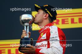 Sebastian Vettel (GER) Ferrari celebrates his third position on the podium. 27.09.2015. Formula 1 World Championship, Rd 14, Japanese Grand Prix, Suzuka, Japan, Race Day.