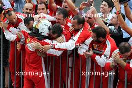 Sebastian Vettel (GER) Ferrari celebrates his third position in parc ferme. 27.09.2015. Formula 1 World Championship, Rd 14, Japanese Grand Prix, Suzuka, Japan, Race Day.