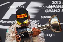 Race winner Lewis Hamilton (GBR) Mercedes AMG F1 celebrates on the podium. 27.09.2015. Formula 1 World Championship, Rd 14, Japanese Grand Prix, Suzuka, Japan, Race Day.