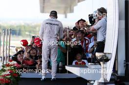 Race winner Lewis Hamilton (GBR) Mercedes AMG F1 signs autographs for the fans on the podium. 27.09.2015. Formula 1 World Championship, Rd 14, Japanese Grand Prix, Suzuka, Japan, Race Day.
