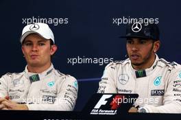 (L to R): Nico Rosberg (GER) Mercedes AMG F1 and team mate Lewis Hamilton (GBR) Mercedes AMG F1 in the FIA Press Conference. 27.09.2015. Formula 1 World Championship, Rd 14, Japanese Grand Prix, Suzuka, Japan, Race Day.