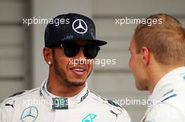 (L to R): Lewis Hamilton (GBR) Mercedes AMG F1 with Valtteri Bottas (FIN) Williams in parc ferme. 26.09.2015. Formula 1 World Championship, Rd 14, Japanese Grand Prix, Suzuka, Japan, Qualifying Day.