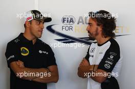 (L to R): Pastor Maldonado (VEN) Lotus F1 Team with Fernando Alonso (ESP) McLaren. 27.09.2015. Formula 1 World Championship, Rd 14, Japanese Grand Prix, Suzuka, Japan, Race Day.