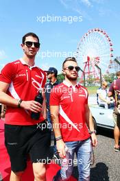 (L to R): Alexander Rossi (USA) Manor Marussia F1 Team and team mate Will Stevens (GBR) Manor Marussia F1 Team on the drivers parade. 27.09.2015. Formula 1 World Championship, Rd 14, Japanese Grand Prix, Suzuka, Japan, Race Day.