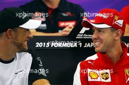 (L to R): Jenson Button (GBR) McLaren with Sebastian Vettel (GER) Ferrari in the FIA Press Conference. 24.09.2015. Formula 1 World Championship, Rd 14, Japanese Grand Prix, Suzuka, Japan, Preparation Day.