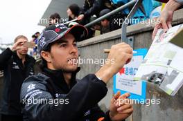 Sergio Perez (MEX) Sahara Force India F1 signs autographs for the fans. 24.09.2015. Formula 1 World Championship, Rd 14, Japanese Grand Prix, Suzuka, Japan, Preparation Day.