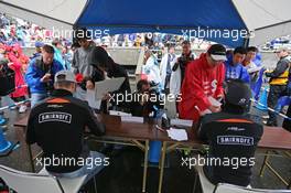 (L to R): Nico Hulkenberg (GER) Sahara Force India F1 and Sergio Perez (MEX) Sahara Force India F1 sign autographs for the fans. 24.09.2015. Formula 1 World Championship, Rd 14, Japanese Grand Prix, Suzuka, Japan, Preparation Day.