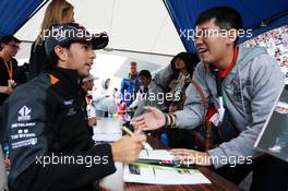 Sergio Perez (MEX) Sahara Force India F1 signs autographs for the fans. 24.09.2015. Formula 1 World Championship, Rd 14, Japanese Grand Prix, Suzuka, Japan, Preparation Day.
