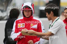 Kimi Raikkonen (FIN) Ferrari signs autographs for the fans. 24.09.2015. Formula 1 World Championship, Rd 14, Japanese Grand Prix, Suzuka, Japan, Preparation Day.