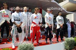 (L to R): Lewis Hamilton (GBR) Mercedes AMG F1; Sebastian Vettel (GER) Ferrari; Daniil Kvyat (RUS) Red Bull Racing; and Sergio Perez (MEX) Sahara Force India F1, as the grid observes the national anthem. 24.05.2015. Formula 1 World Championship, Rd 6, Monaco Grand Prix, Monte Carlo, Monaco, Race Day.