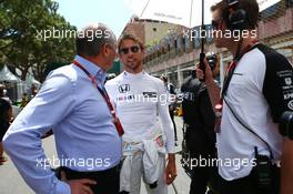 (L to R): Ron Dennis (GBR) McLaren Executive Chairman with Jenson Button (GBR) McLaren and Mike Collier (GBR) Personal Trainer of Jenson Button (GBR) McLaren on the grid. 24.05.2015. Formula 1 World Championship, Rd 6, Monaco Grand Prix, Monte Carlo, Monaco, Race Day.