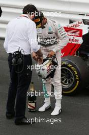 Lewis Hamilton (GBR) Mercedes AMG F1 with Matteo Bonciani (ITA) FIA Media Delegate at the podium. 24.05.2015. Formula 1 World Championship, Rd 6, Monaco Grand Prix, Monte Carlo, Monaco, Race Day.
