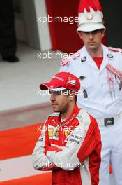 Sebastian Vettel (GER) Ferrari on the podium. 24.05.2015. Formula 1 World Championship, Rd 6, Monaco Grand Prix, Monte Carlo, Monaco, Race Day.