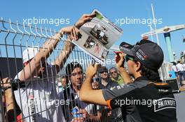 Sergio Perez (MEX) Sahara Force India F1 signs autographs for the fans. 20.05.2015. Formula 1 World Championship, Rd 6, Monaco Grand Prix, Monte Carlo, Monaco, Preparation Day.