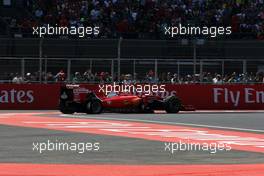 Sebastian Vettel (GER) Ferrari SF15-T with a puncture on the opening lap of the race. 01.11.2015. Formula 1 World Championship, Rd 17, Mexican Grand Prix, Mexixo City, Mexico, Race Day.