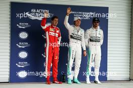 Qualifying top three in parc ferme (L to R): Sebastian Vettel (GER) Ferrari, third; Nico Rosberg (GER) Mercedes AMG F1, pole position; Lewis Hamilton (GBR) Mercedes AMG F1, second. 31.10.2015. Formula 1 World Championship, Rd 17, Mexican Grand Prix, Mexixo City, Mexico, Qualifying Day.