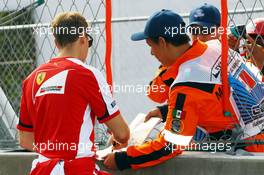Sebastian Vettel (GER) Ferrari signs autographs for the fans. 29.10.2015. Formula 1 World Championship, Rd 17, Mexican Grand Prix, Mexixo City, Mexico, Preparation Day.