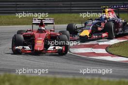 Kimi Raikkonen (FIN) Ferrari SF15-T leads Daniil Kvyat (RUS) Red Bull Racing RB11. 27.03.2015. Formula 1 World Championship, Rd 2, Malaysian Grand Prix, Sepang, Malaysia, Friday.