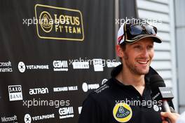 Romain Grosjean (FRA) Lotus F1 Team with the media. 27.03.2015. Formula 1 World Championship, Rd 2, Malaysian Grand Prix, Sepang, Malaysia, Friday.