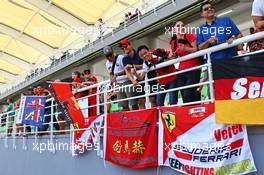 Fans and flags in the grandstand. 29.03.2015. Formula 1 World Championship, Rd 2, Malaysian Grand Prix, Sepang, Malaysia, Sunday.