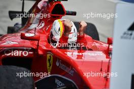Race winner Sebastian Vettel (GER) Ferrari SF15-T celebrates in parc ferme. 29.03.2015. Formula 1 World Championship, Rd 2, Malaysian Grand Prix, Sepang, Malaysia, Sunday.