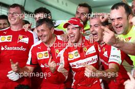 1st place Sebastian Vettel (GER) Ferrari celebrates with the team. 29.03.2015. Formula 1 World Championship, Rd 2, Malaysian Grand Prix, Sepang, Malaysia, Sunday.