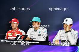 The post qualifying FIA Press Conference Sebastian Vettel (GER) Ferrari, second; Lewis Hamilton (GBR) Mercedes AMG F1, pole position; Nico Rosberg (GER) Mercedes AMG F1, third. 28.03.2015. Formula 1 World Championship, Rd 2, Malaysian Grand Prix, Sepang, Malaysia, Saturday.