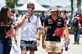 (L to R): Tabatha Valles (ESP) Scuderia Toro Rosso Press Officer with Marcus Ericsson (SWE) Sauber F1 Team and Carlos Sainz Jr (ESP) Scuderia Toro Rosso. 29.03.2015. Formula 1 World Championship, Rd 2, Malaysian Grand Prix, Sepang, Malaysia, Sunday.