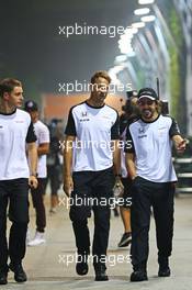 (L to R): Stoffel Vandoorne (BEL) McLaren Test and Reserve Driver with Jenson Button (GBR) McLaren and Fernando Alonso (ESP) McLaren. 18.09.2015. Formula 1 World Championship, Rd 13, Singapore Grand Prix, Singapore, Singapore, Practice Day.