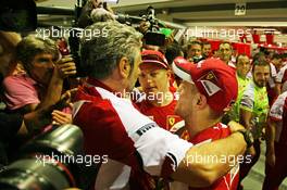 Race winner Sebastian Vettel (GER) Ferrari celebrates with Maurizio Arrivabene (ITA) Ferrari Team Principal and team mate Kimi Raikkonen (FIN) Ferrari. 20.09.2015. Formula 1 World Championship, Rd 13, Singapore Grand Prix, Singapore, Singapore, Race Day.