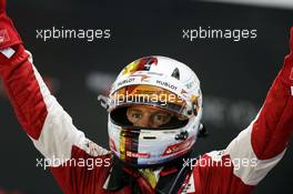 Race winner Sebastian Vettel (GER) Ferrari celebrates in parc ferme. 20.09.2015. Formula 1 World Championship, Rd 13, Singapore Grand Prix, Singapore, Singapore, Race Day.