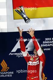 Race winner Sebastian Vettel (GER) Ferrari celebrates on the podium. 20.09.2015. Formula 1 World Championship, Rd 13, Singapore Grand Prix, Singapore, Singapore, Race Day.