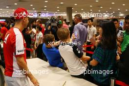Sebastian Vettel (GER) Ferrari with fans. 17.09.2015. Formula 1 World Championship, Rd 13, Singapore Grand Prix, Singapore, Singapore, Preparation Day.