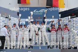 The podium (L to R): Marc Lieb (GER), Romain Dumas (FRA), Neel Jani (SUI) #18 Porsche Team Porsche 919 Hybrid, second;  Mark Webber (AUS) / Brendon Hartley  (NZL), Timo Bernhard (GER) #17 Porsche Team Porsche 919 Hybrid, race winners; Marcel Fassler (SUI) / Andre Lotterer (GER) / Benoit Treluyer (FRA) #07 Audi Sport Team Joest Audi R18 e-tron quattro Hybrid, third. 30.08.2015. FIA World Endurance Championship, Round 4, Nurburgring, Germany, Sunday.