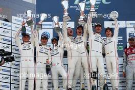 The podium (L to R): Marc Lieb (GER), Romain Dumas (FRA), Neel Jani (SUI) #18 Porsche Team Porsche 919 Hybrid, second;  Mark Webber (AUS) / Brendon Hartley  (NZL), Timo Bernhard (GER) #17 Porsche Team Porsche 919 Hybrid, race winners. 30.08.2015. FIA World Endurance Championship, Round 4, Nurburgring, Germany, Sunday.