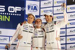 (L to R): Brendon Hartley (NZL); Timo Bernhard (GER); and Mark Webber (AUS) #17 Porsche Team Porsche 919 Hybrid, celebrate winning the World Championship on the podium. 21.11.2015. FIA World Endurance Championship, Round 8, Six Hours of Bahrain, Sakhir, Bahrain, Saturday.