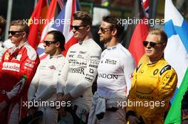 Nico Hulkenberg (GER) Sahara Force India F1 and Jenson Button (GBR) McLaren as the grid observes the national anthem. 20.03.2016. Formula 1 World Championship, Rd 1, Australian Grand Prix, Albert Park, Melbourne, Australia, Race Day.