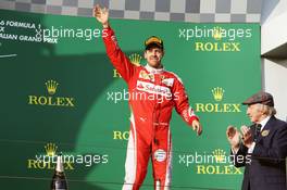Sebastian Vettel (GER) Ferrari celebrates his third position on the podium. 20.03.2016. Formula 1 World Championship, Rd 1, Australian Grand Prix, Albert Park, Melbourne, Australia, Race Day.