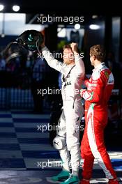 Race winner Nico Rosberg (GER) Mercedes AMG F1 celebrates in parc ferme with third placed Sebastian Vettel (GER) Ferrari. 20.03.2016. Formula 1 World Championship, Rd 1, Australian Grand Prix, Albert Park, Melbourne, Australia, Race Day.