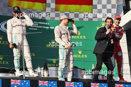 The podium (L to R): Lewis Hamilton (GBR) Mercedes AMG F1, second; Nico Rosberg (GER) Mercedes AMG F1, race winner; Mark Webber (AUS) Porsche Team WEC Driver / Channel 4 Presenter; Sebastian Vettel (GER) Ferrari, third. 20.03.2016. Formula 1 World Championship, Rd 1, Australian Grand Prix, Albert Park, Melbourne, Australia, Race Day.