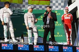 The podium (L to R): Lewis Hamilton (GBR) Mercedes AMG F1, second; Nico Rosberg (GER) Mercedes AMG F1, race winner; Mark Webber (AUS) Porsche Team WEC Driver / Channel 4 Presenter; Sebastian Vettel (GER) Ferrari, third. 20.03.2016. Formula 1 World Championship, Rd 1, Australian Grand Prix, Albert Park, Melbourne, Australia, Race Day.