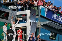 The podium (L to R): Lewis Hamilton (GBR) Mercedes AMG F1, second; Nico Rosberg (GER) Mercedes AMG F1, race winner; Sebastian Vettel (GER) Ferrari, third. 20.03.2016. Formula 1 World Championship, Rd 1, Australian Grand Prix, Albert Park, Melbourne, Australia, Race Day.