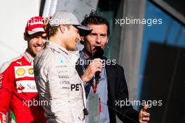 Race winner Nico Rosberg (GER) Mercedes AMG F1 on the podium with Mark Webber (AUS) Porsche Team WEC Driver / Channel 4 Presenter and Sebastian Vettel (GER) Ferrari. 20.03.2016. Formula 1 World Championship, Rd 1, Australian Grand Prix, Albert Park, Melbourne, Australia, Race Day.