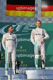 (L to R): Second placed Lewis Hamilton (GBR) Mercedes AMG F1 on the podium with team mate and race winner Nico Rosberg (GER) Mercedes AMG F1. 20.03.2016. Formula 1 World Championship, Rd 1, Australian Grand Prix, Albert Park, Melbourne, Australia, Race Day.