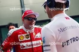 (L to R): Kimi Raikkonen (FIN) Ferrari with Nico Rosberg (GER) Mercedes AMG F1. 20.03.2016. Formula 1 World Championship, Rd 1, Australian Grand Prix, Albert Park, Melbourne, Australia, Race Day.