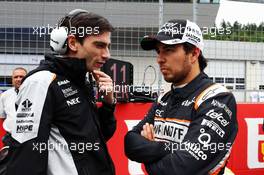 Sergio Perez (MEX) Sahara Force India F1 with Tim Wright (GBR) Sahara Force India F1 Team Race Engineer on the grid. 03.07.2016. Formula 1 World Championship, Rd 9, Austrian Grand Prix, Spielberg, Austria, Race Day.