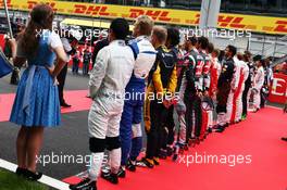 Rio Haryanto (IDN) Manor Racing as the grid observes the national anthem. 03.07.2016. Formula 1 World Championship, Rd 9, Austrian Grand Prix, Spielberg, Austria, Race Day.