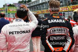 (L to R): Lewis Hamilton (GBR) Mercedes AMG F1 and Nico Hulkenberg (GER) Sahara Force India F1 as the grid observes the national anthem. 03.07.2016. Formula 1 World Championship, Rd 9, Austrian Grand Prix, Spielberg, Austria, Race Day.