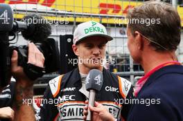 Nico Hulkenberg (GER) Sahara Force India F1 with David Coulthard (GBR) Red Bull Racing and Scuderia Toro Advisor / Channel 4 F1 Commentator on the grid. 03.07.2016. Formula 1 World Championship, Rd 9, Austrian Grand Prix, Spielberg, Austria, Race Day.